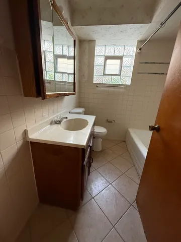 a kitchen with granite countertop a sink and a stove top oven