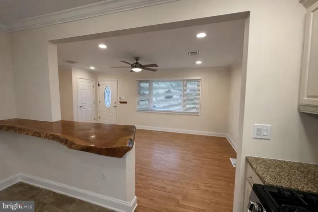 a kitchen with granite countertop cabinets and sink