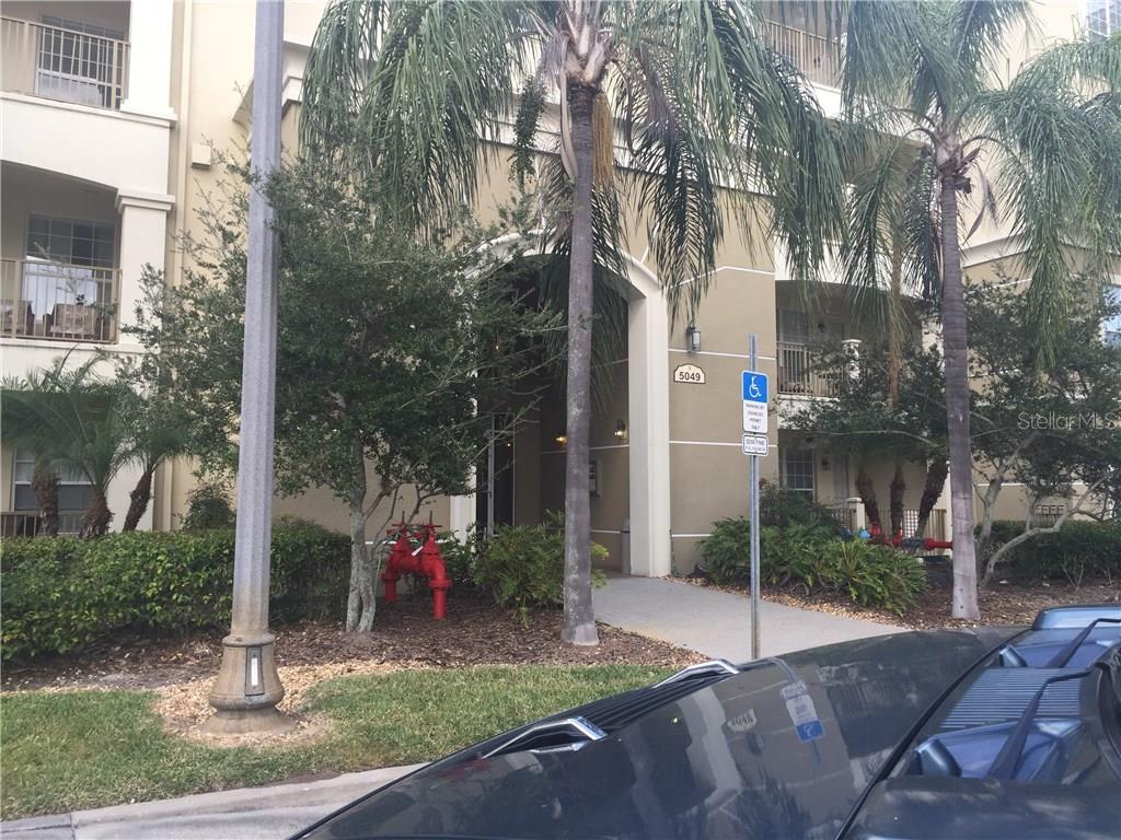 5049 Shoreway Loop, Unit 103 Orlando, FL 32819 - Photo 1 of 1 a view of a park with iron fence