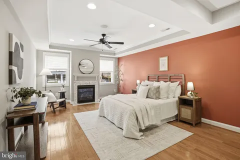 a living room with furniture a window and a fireplace