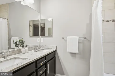 a kitchen with a sink and a refrigerator