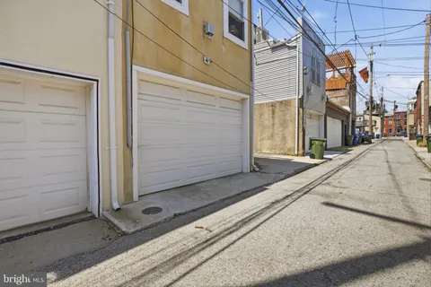 a front view of a house with parking space