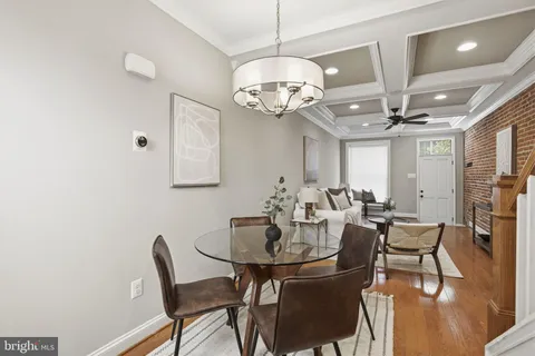 a kitchen with kitchen island a sink stainless steel appliances and cabinets