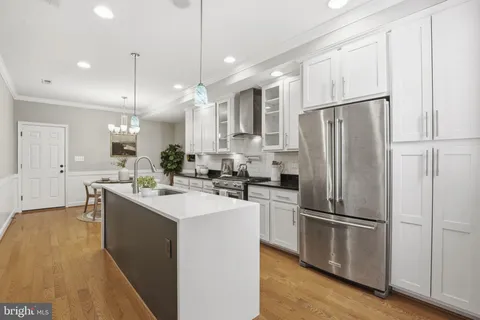 a kitchen with a sink stove and refrigerator