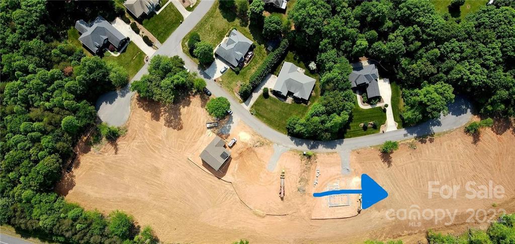 205 9th Street Northeast, Unit 80 Conover, NC 28613 - Photo 2 of 2 an aerial view of a house with a yard and lake view