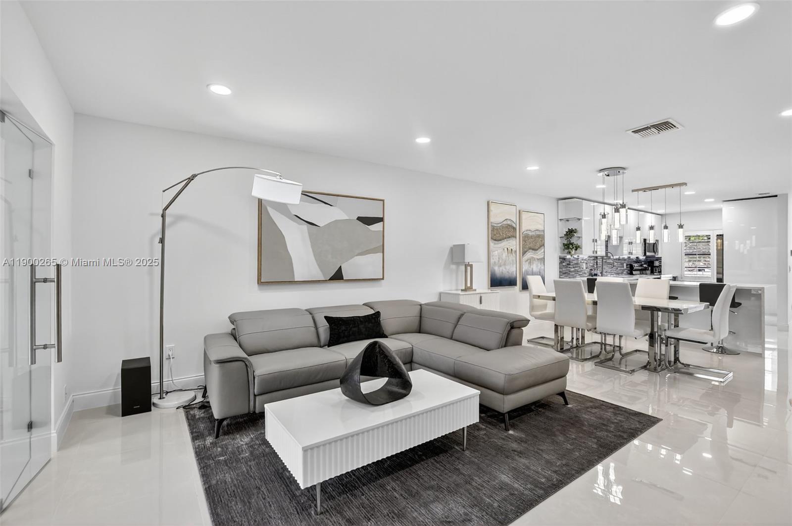 21860 Arriba Real, Unit 4D Boca Raton, FL 33433 - Photo 13 of 55 a living room with furniture and wooden floor