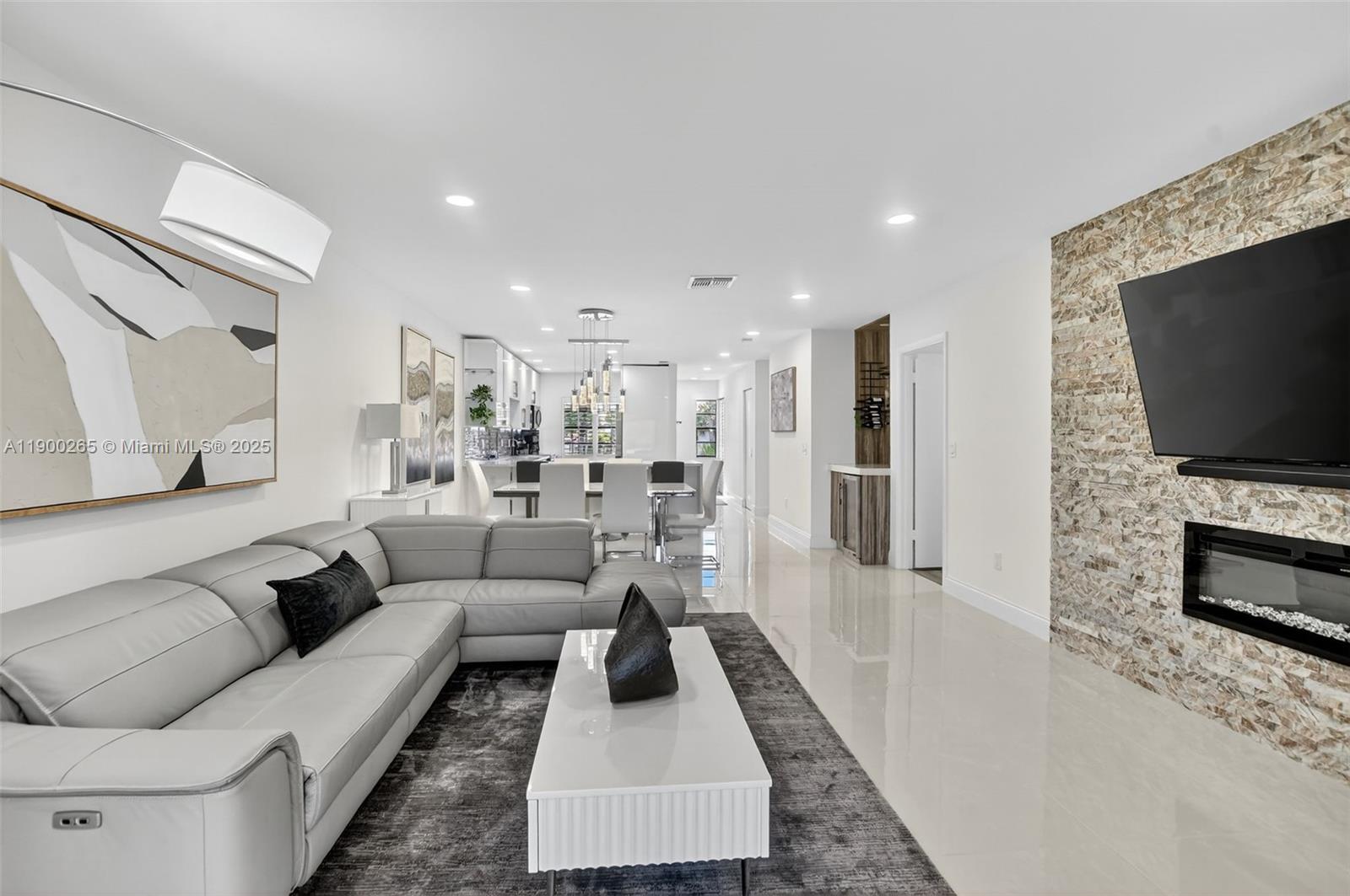 21860 Arriba Real, Unit 4D Boca Raton, FL 33433 - Photo 14 of 55 a living room with furniture and a flat screen tv