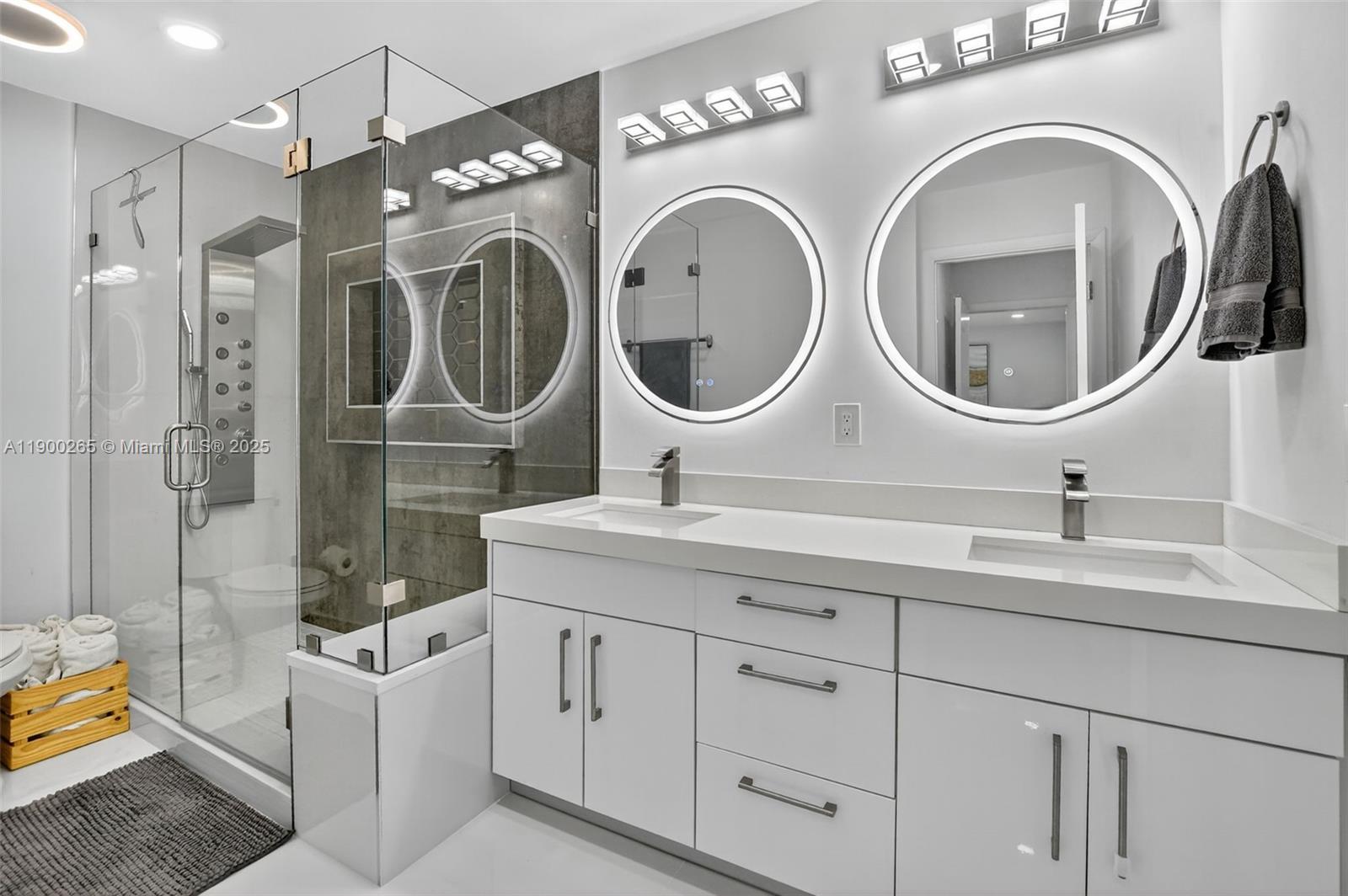 21860 Arriba Real, Unit 4D Boca Raton, FL 33433 - Photo 19 of 55 a bathroom with a double vanity sink mirror and bathtub