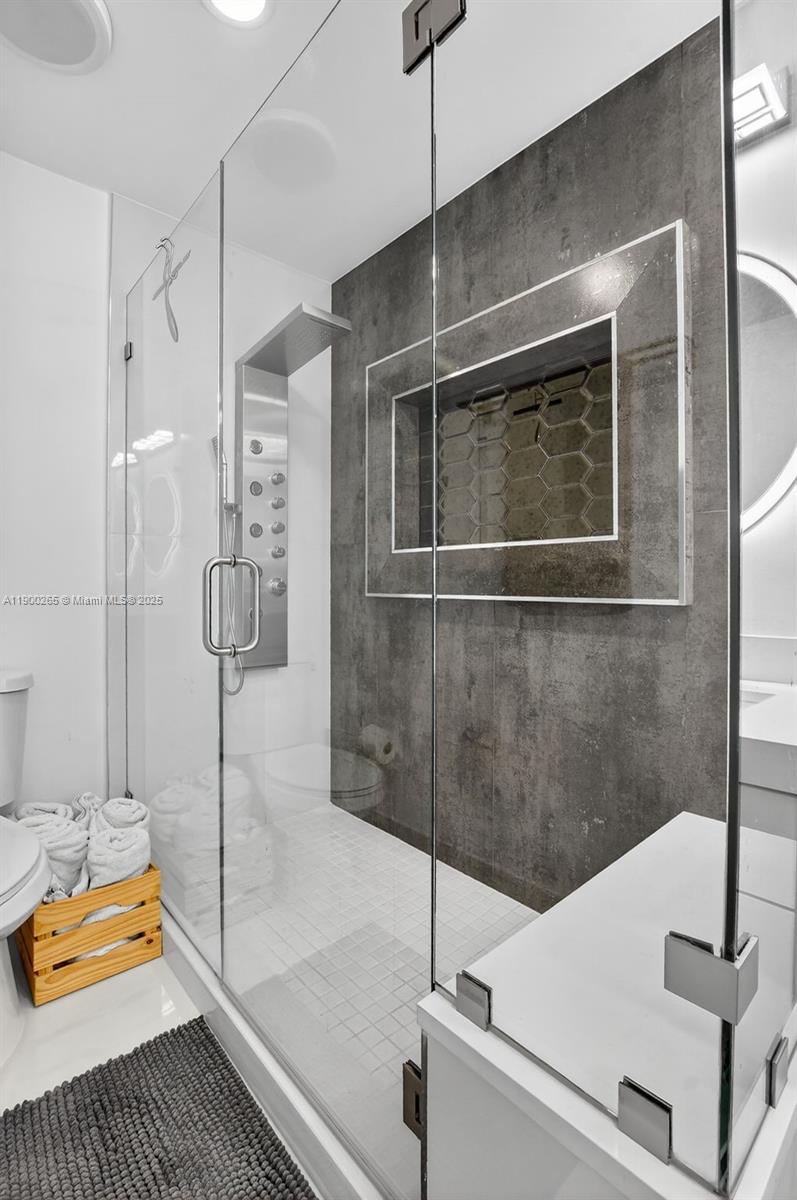 21860 Arriba Real, Unit 4D Boca Raton, FL 33433 - Photo 21 of 55 a bathroom with a sink and a shower