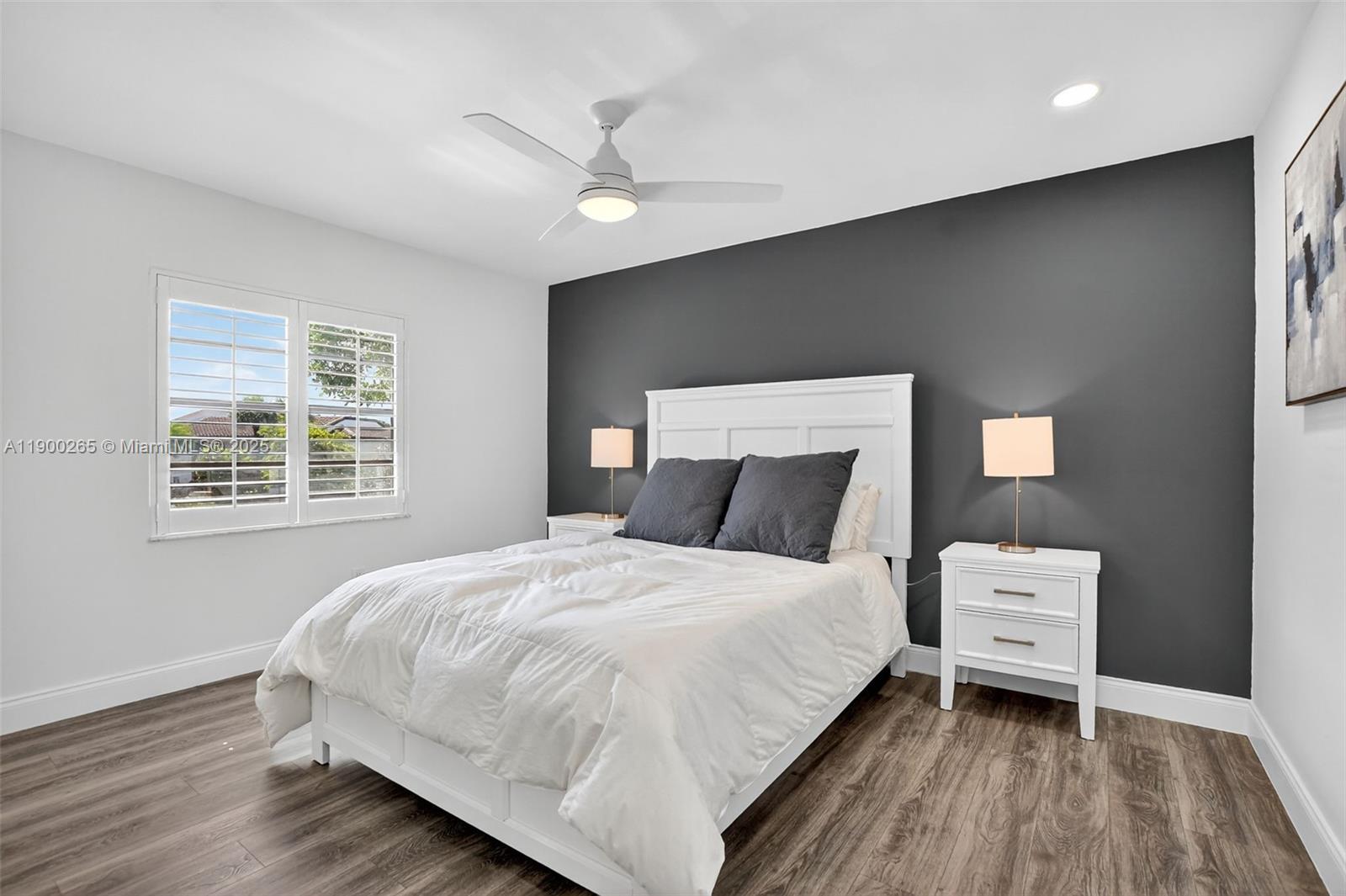 21860 Arriba Real, Unit 4D Boca Raton, FL 33433 - Photo 22 of 55 a bedroom with a bed and a window