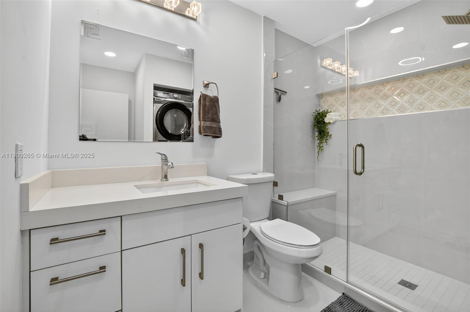 21860 Arriba Real, Unit 4D Boca Raton, FL 33433 - Photo 24 of 55 a bathroom with a toilet a sink and a mirror