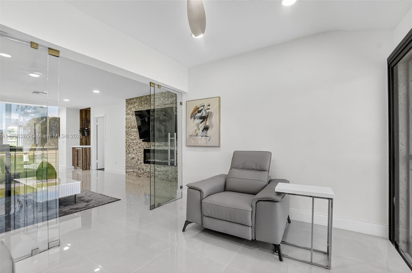 21860 Arriba Real, Unit 4D Boca Raton, FL 33433 - Photo 28 of 55 a living room with furniture and a large window
