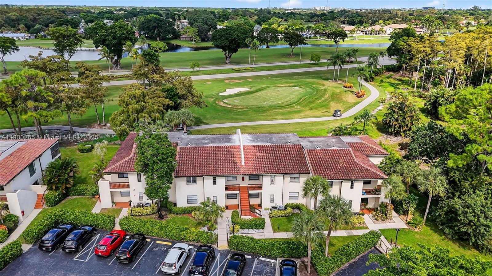 21860 Arriba Real, Unit 4D Boca Raton, FL 33433 - Photo 32 of 55 an aerial view of a house with a garden and lake view