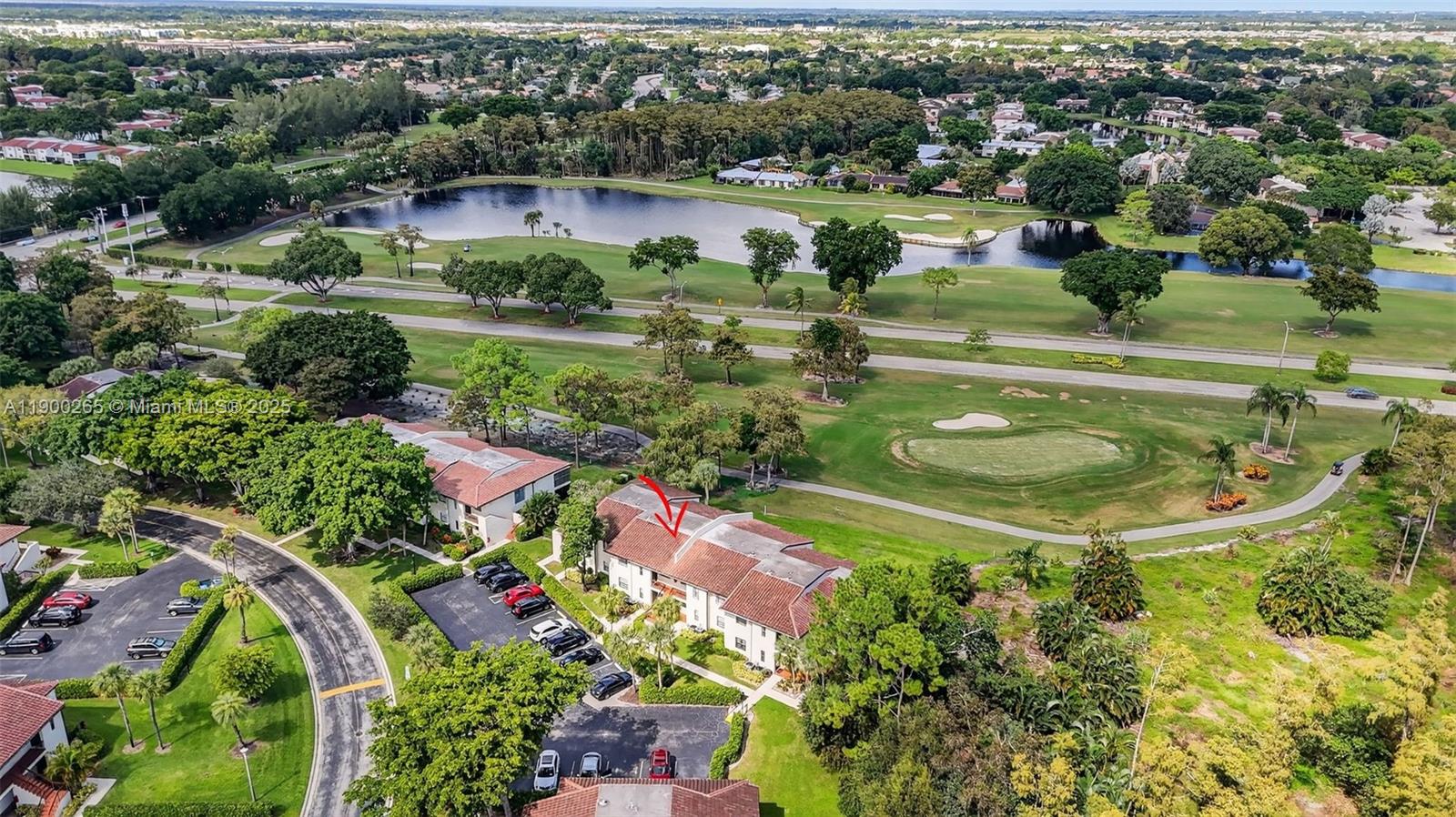 21860 Arriba Real, Unit 4D Boca Raton, FL 33433 - Photo 35 of 55 an aerial view of residential houses with outdoor space and trees