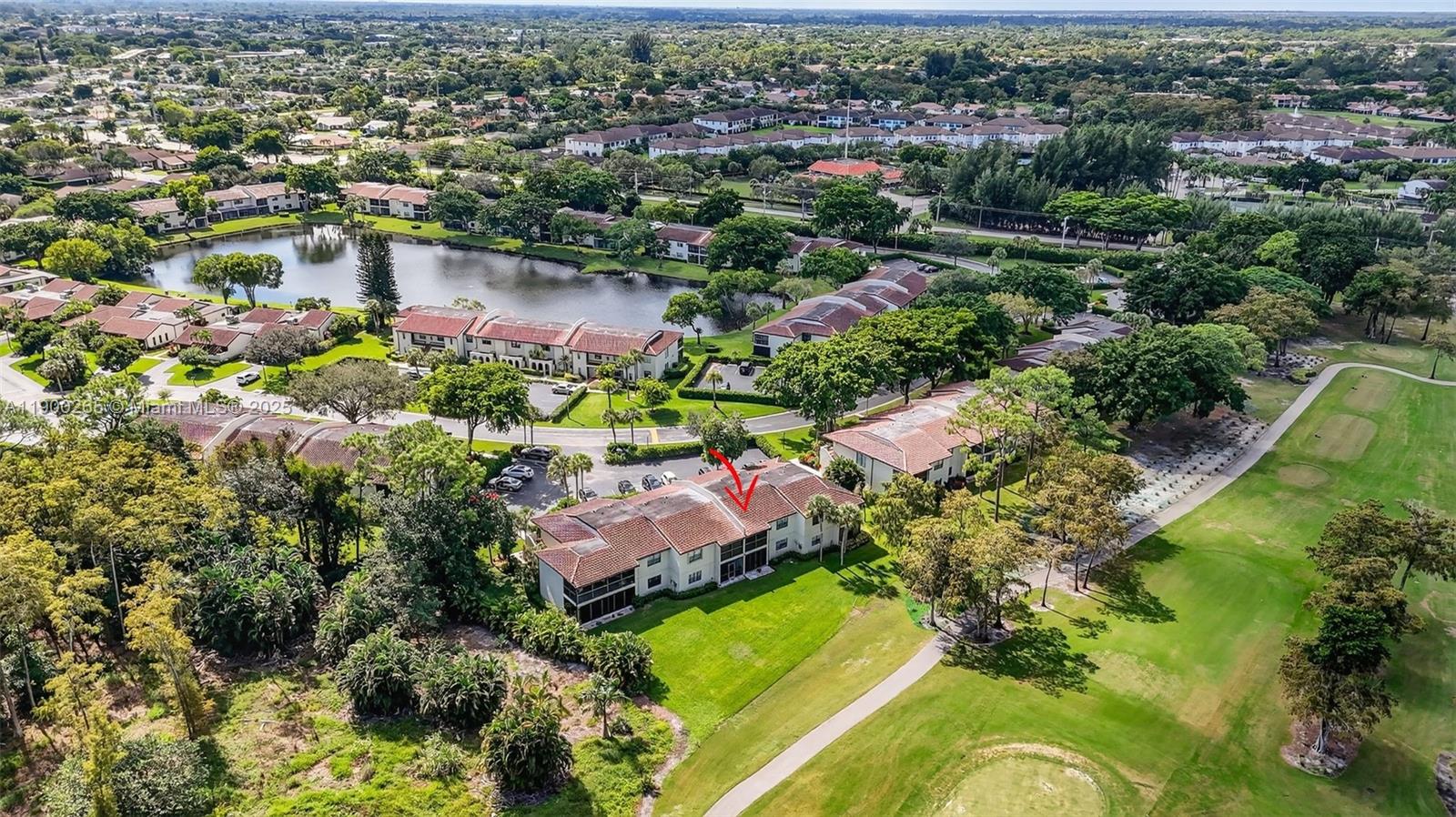 21860 Arriba Real, Unit 4D Boca Raton, FL 33433 - Photo 38 of 55 an aerial view of a houses with a lake view