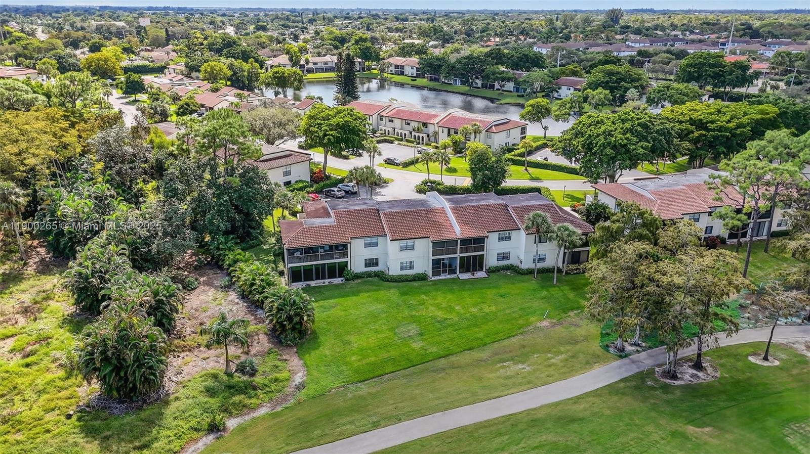 21860 Arriba Real, Unit 4D Boca Raton, FL 33433 - Photo 41 of 55 an aerial view of a house with a garden