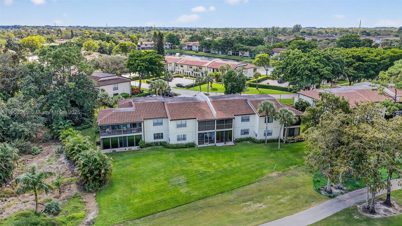 21860 Arriba Real, Unit 4D Boca Raton, FL 33433 - Photo 42 of 55 an aerial view of a house with garden