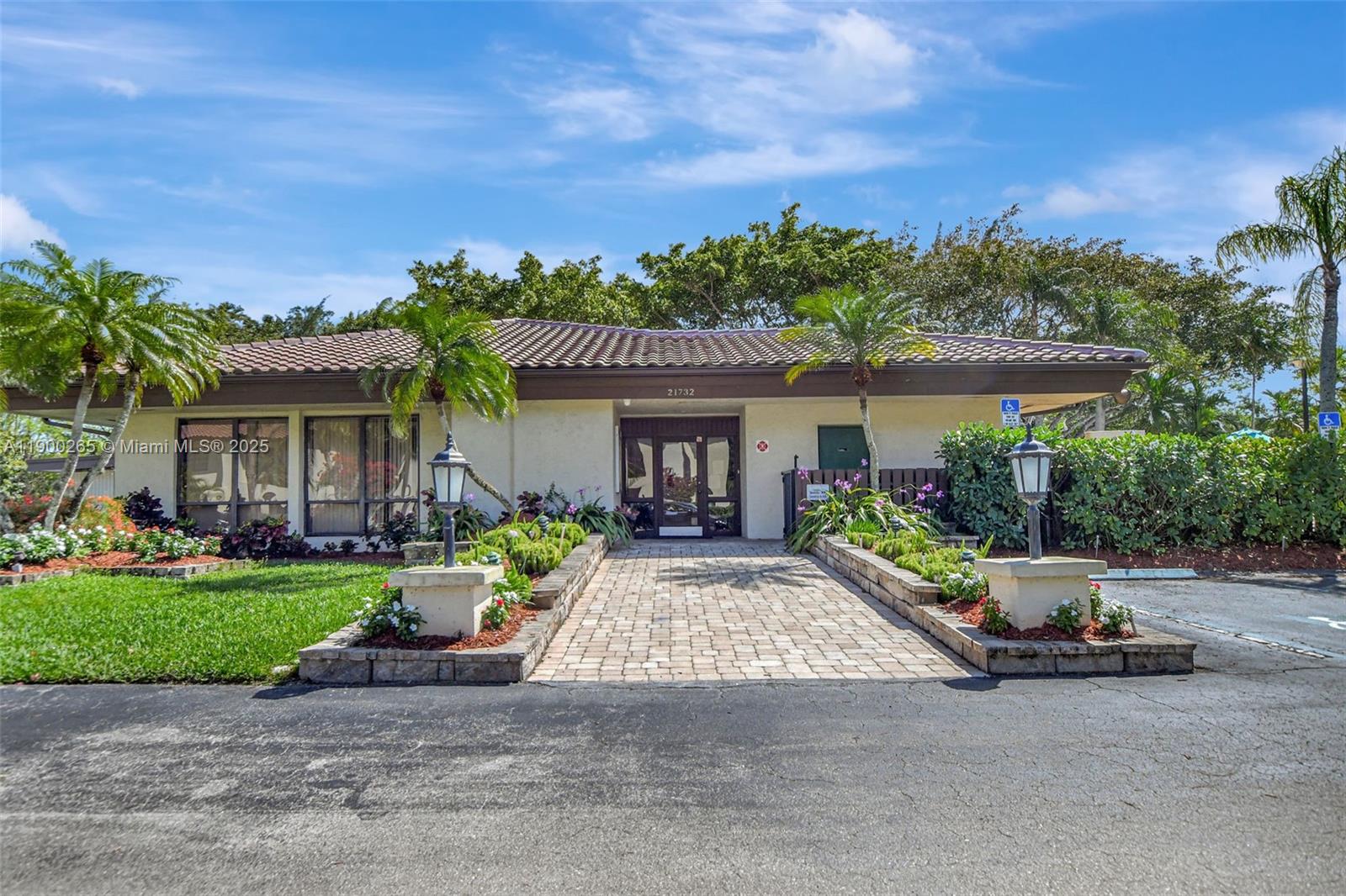 21860 Arriba Real, Unit 4D Boca Raton, FL 33433 - Photo 44 of 55 a view of a house with a garden and pathway