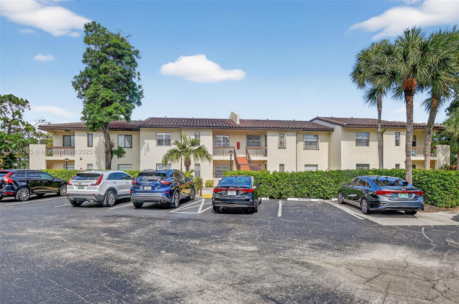 21860 Arriba Real, Unit 4D Boca Raton, FL 33433 - Photo 55 of 55 a car parked in front of a house