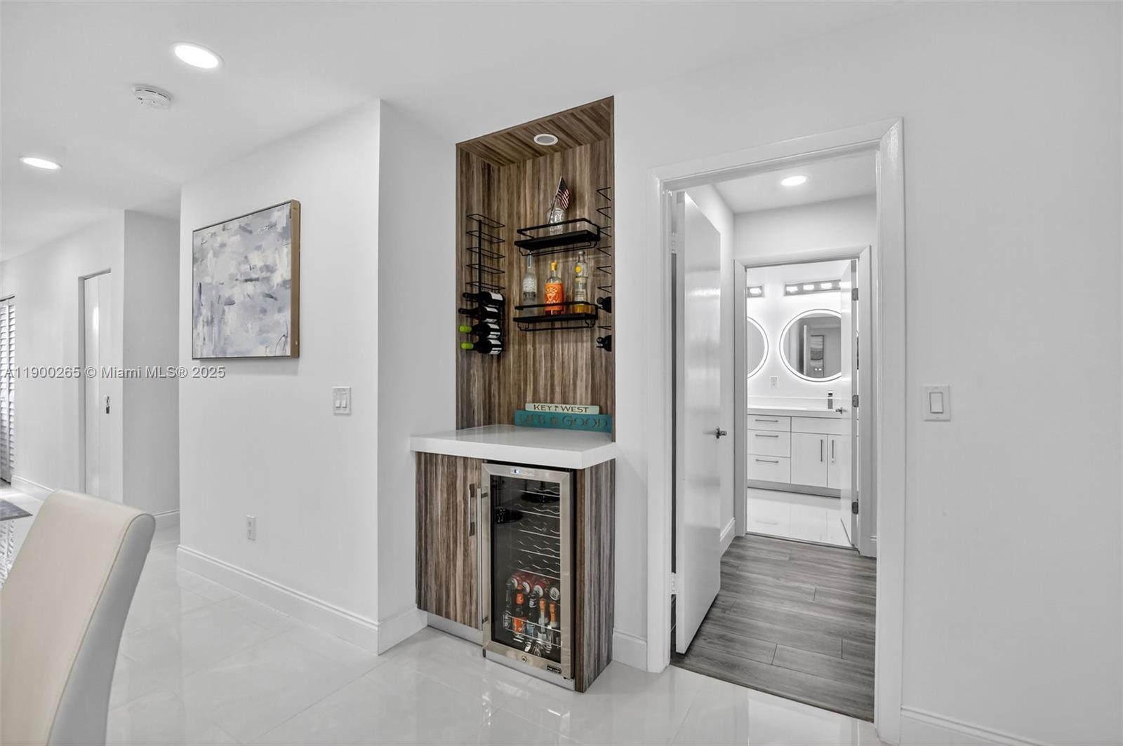 21860 Arriba Real, Unit 4D Boca Raton, FL 33433 - Photo 10 of 55 a view of a hallway with wooden floor and entryway