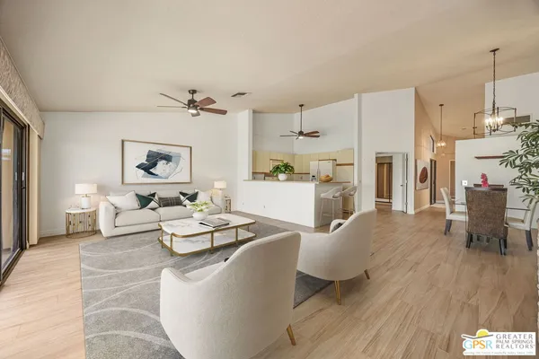 a living room with furniture a fireplace and a table