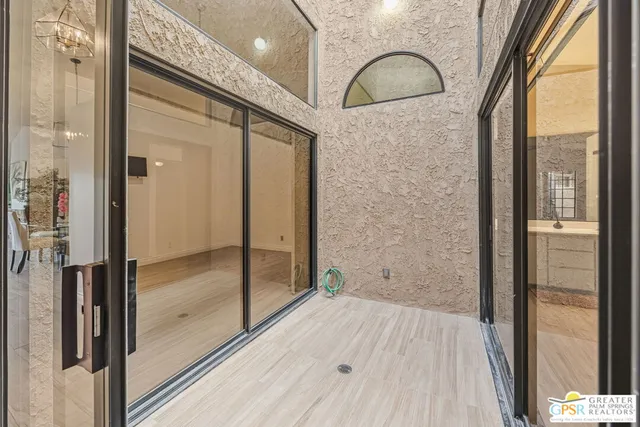 a view of a livingroom with a furniture wooden floor and a window