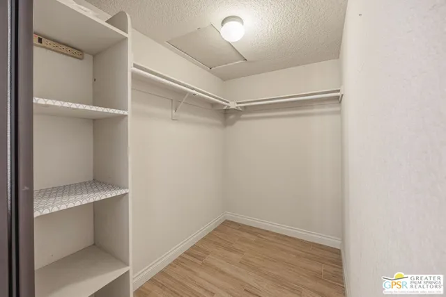 a spacious bathroom with a double vanity sink and mirror