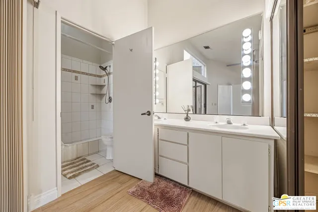 a bathroom with a shower and toilet