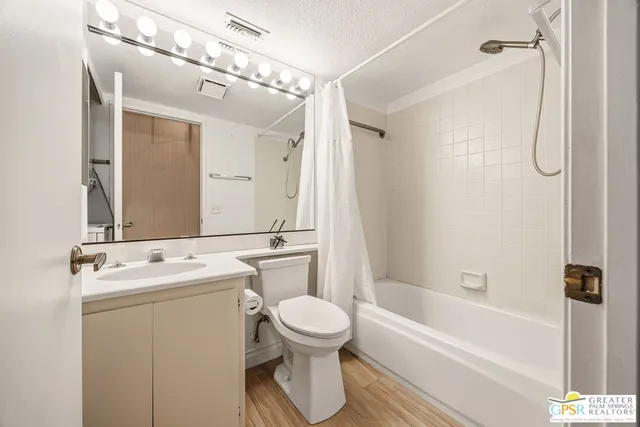a view of a patio with table and chairs and potted plants