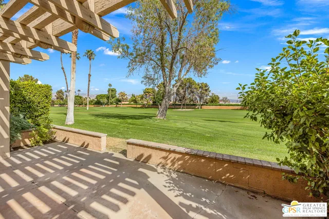a swimming pool with outdoor seating