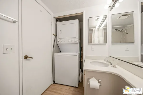 a kitchen with cabinets appliances and a sink