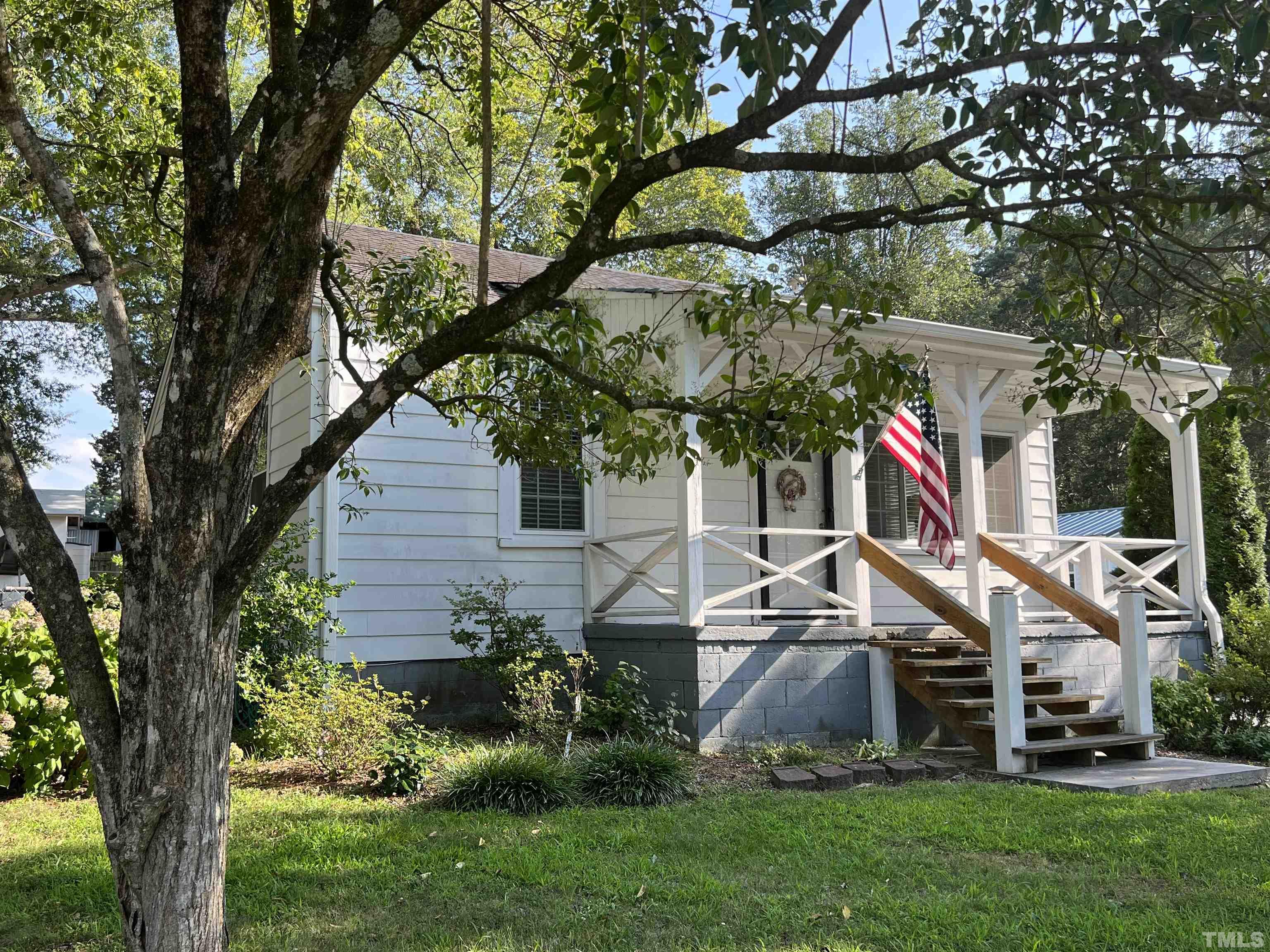 3912 Cheek Road Durham, NC 27704 - Photo 1 of 11 a view of house with a yard