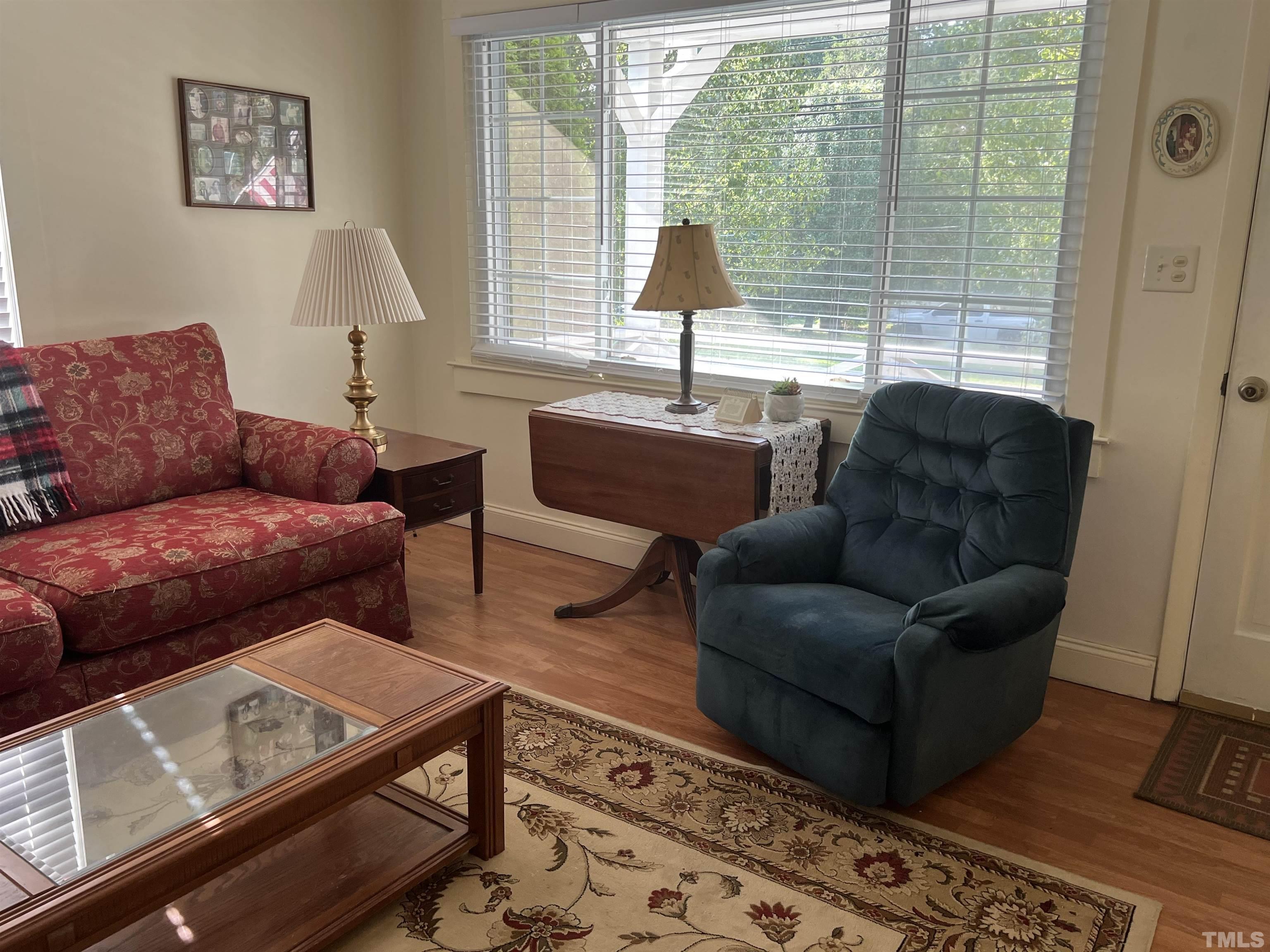 3912 Cheek Road Durham, NC 27704 - Photo 8 of 11 a living room with furniture and a window