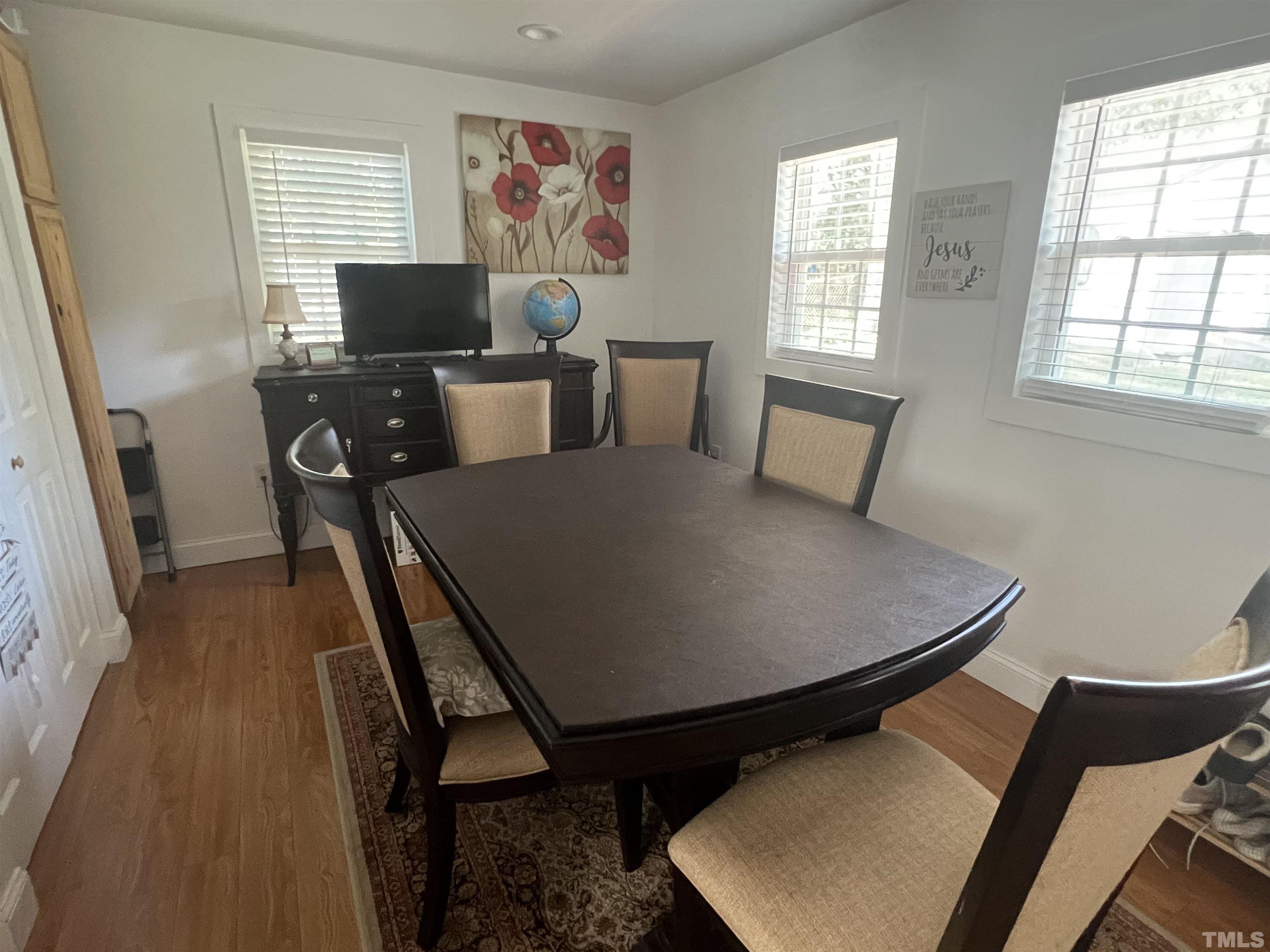 3912 Cheek Road Durham, NC 27704 - Photo 9 of 11 a view of a workspace with furniture and a window