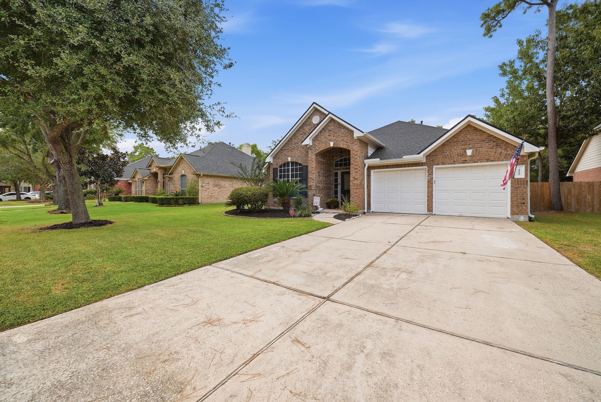 2223 Lazy Trail Path Court Spring, TX 77373 - Photo 21 of 23 Charming brick home with a spacious two-car garage, manicured lawn, and inviting entryway set in a serene neighborhood.