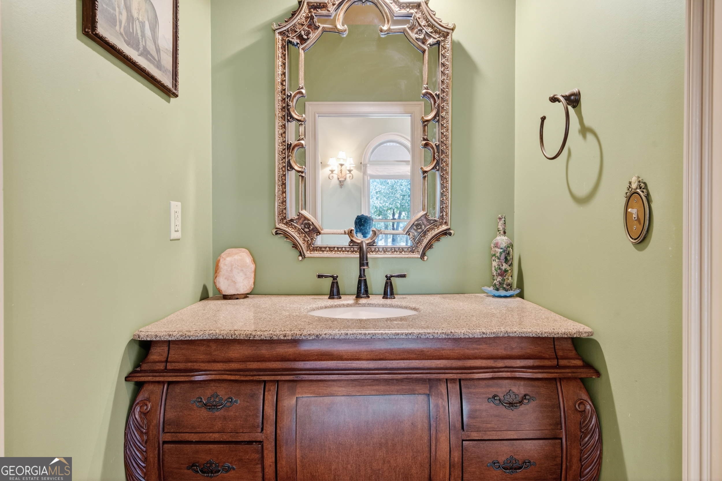 1583 Hickory Flat Road Gillsville, GA 30543 - Photo 11 of 79 a bathroom with a sink and a mirror