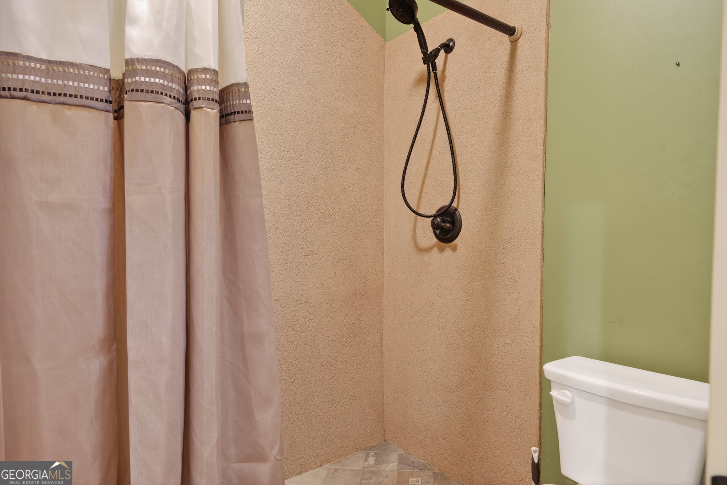 1583 Hickory Flat Road Gillsville, GA 30543 - Photo 12 of 79 a bathroom with a shower and toilet