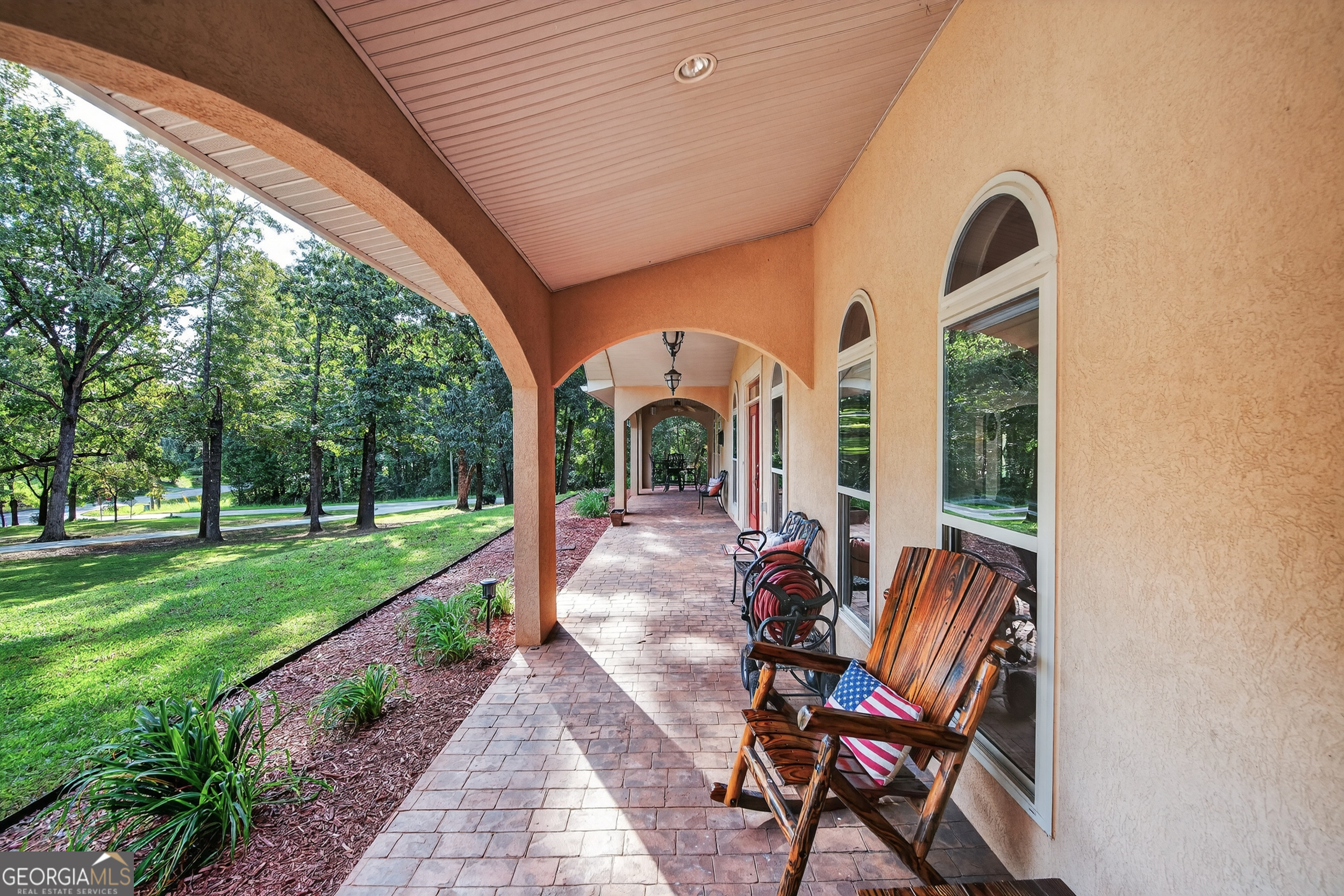 1583 Hickory Flat Road Gillsville, GA 30543 - Photo 4 of 79 a view of a chair and table in backyard of the house