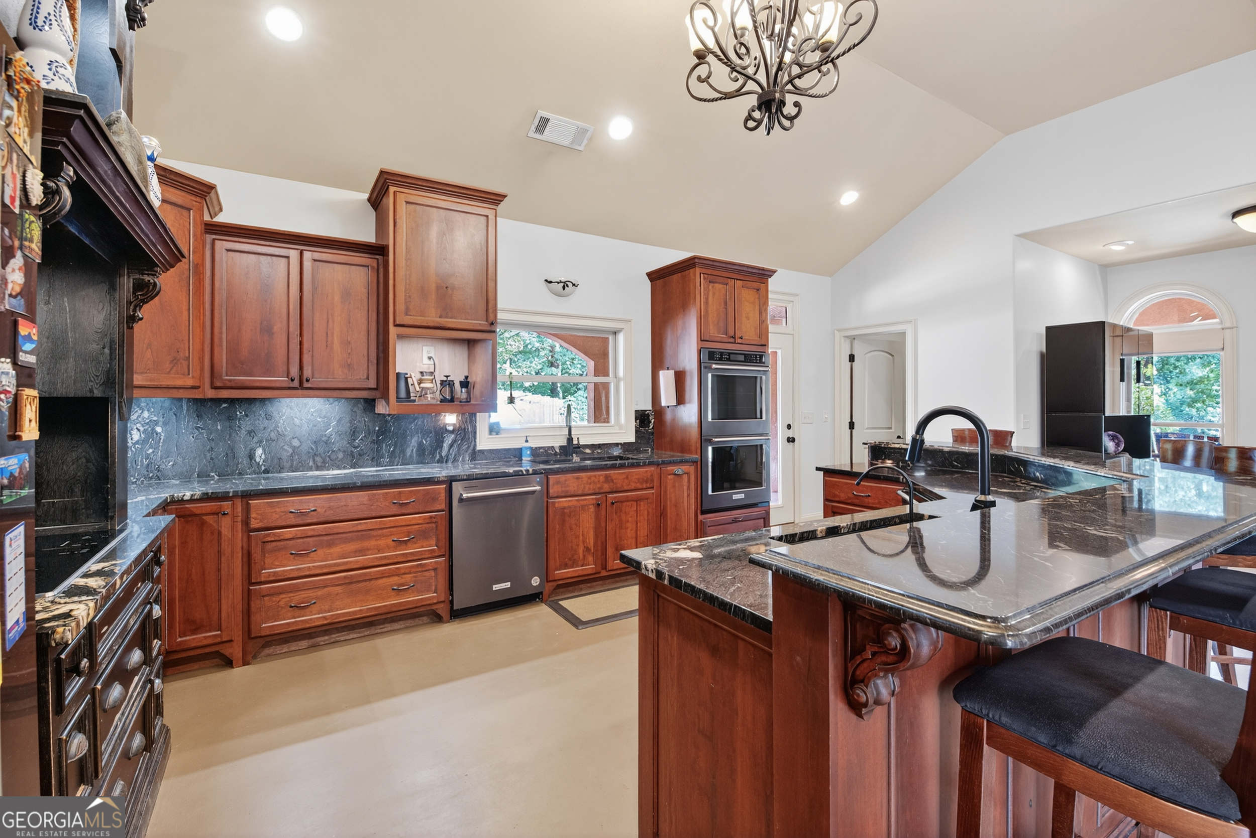 1583 Hickory Flat Road Gillsville, GA 30543 - Photo 44 of 79 a kitchen with stainless steel appliances granite countertop a sink a stove and a refrigerator