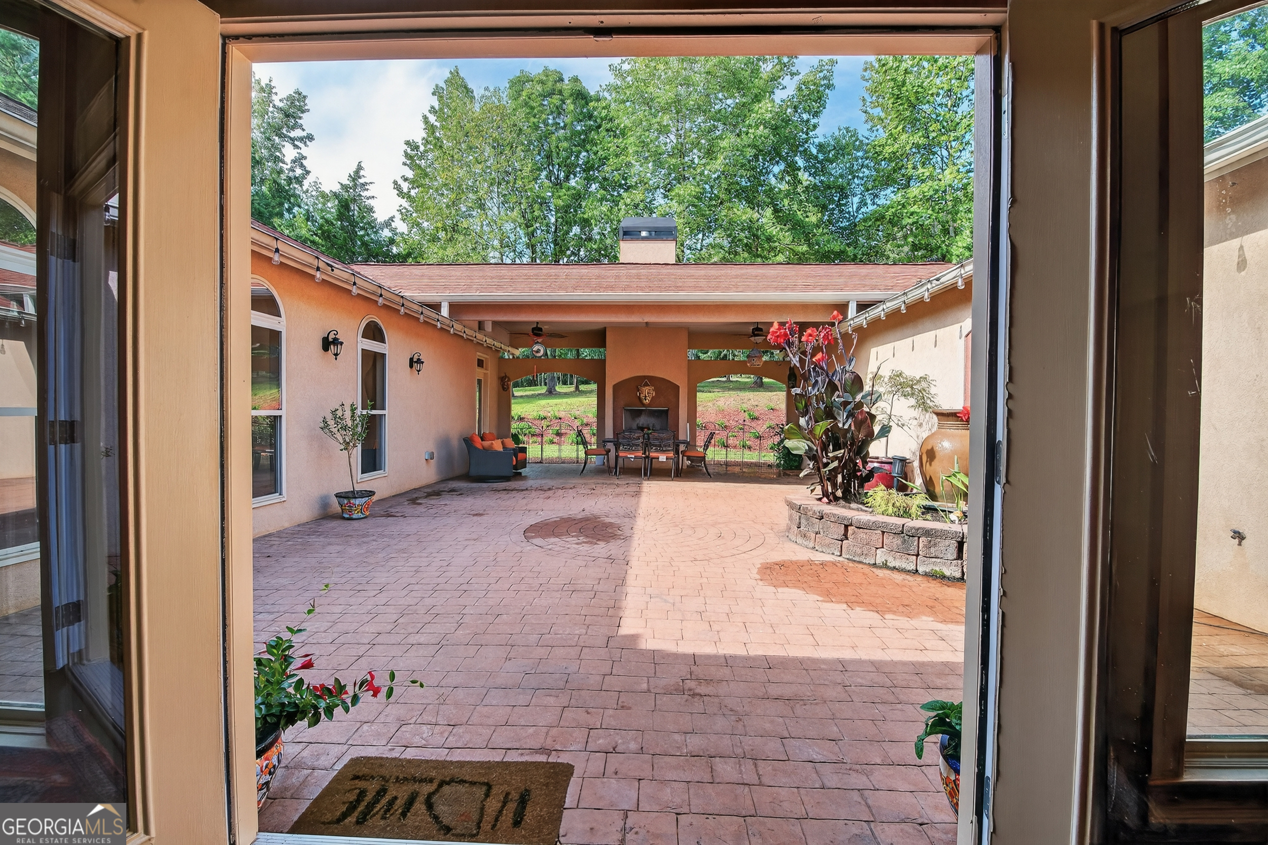 1583 Hickory Flat Road Gillsville, GA 30543 - Photo 46 of 79 a view of a porch with furniture and floor to ceiling window