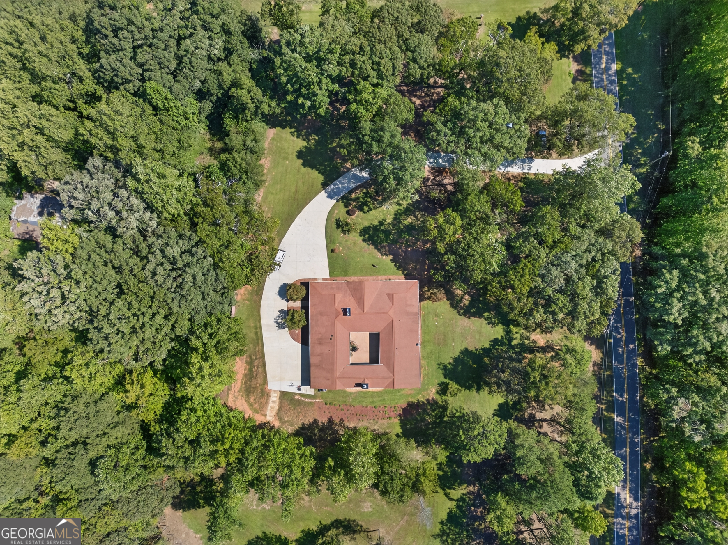 1583 Hickory Flat Road Gillsville, GA 30543 - Photo 62 of 79 an aerial view of a house with a yard and trees all around