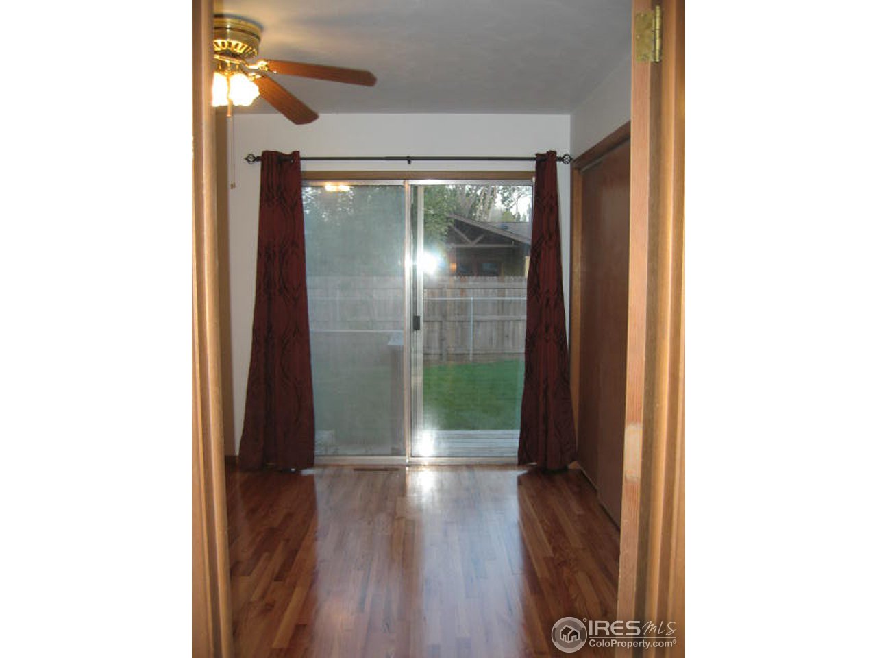 1208 Baker Street Fort Collins, CO 80524 - Photo 11 of 25 a view of a hallway with wooden floor
