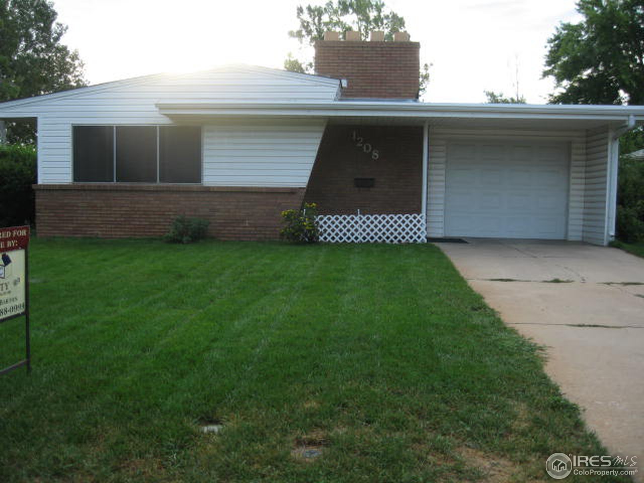 1208 Baker Street Fort Collins, CO 80524 - Photo 25 of 25 a front view of a house with garage