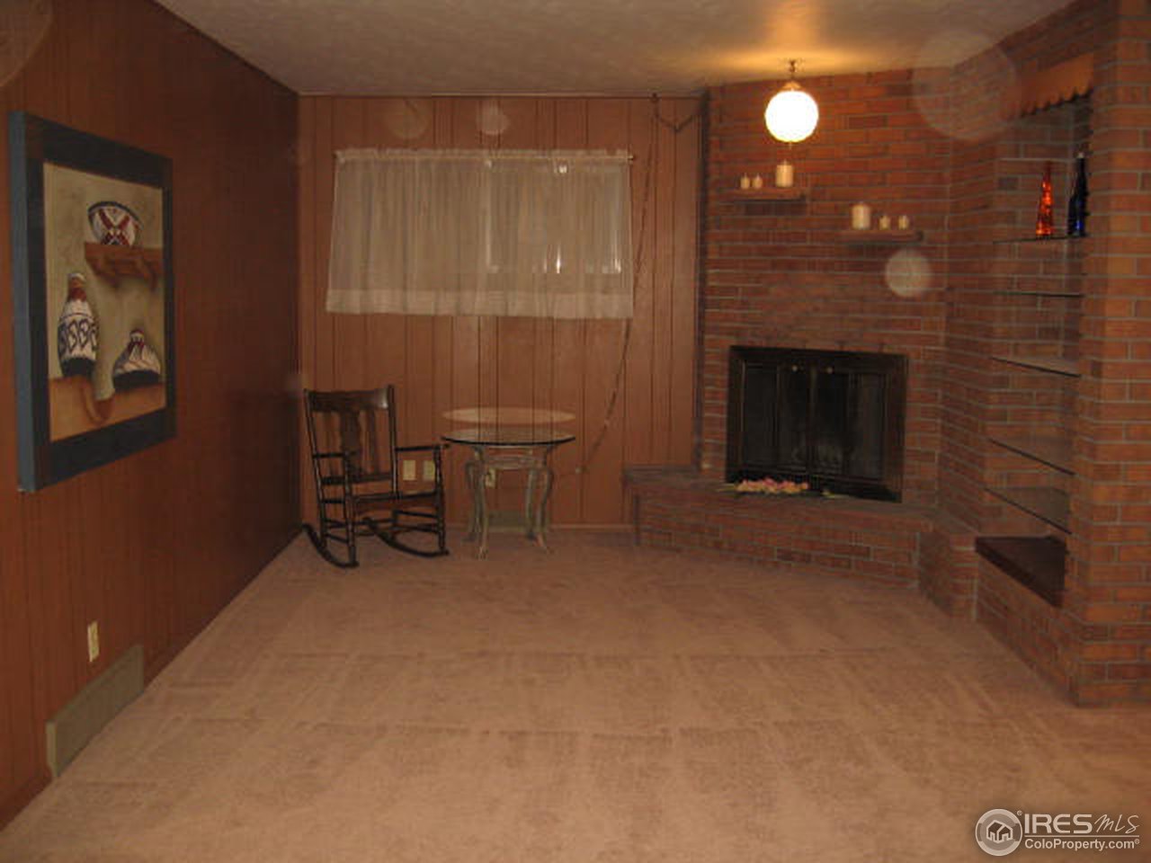1208 Baker Street Fort Collins, CO 80524 - Photo 3 of 25 a view of a livingroom with furniture and a fireplace