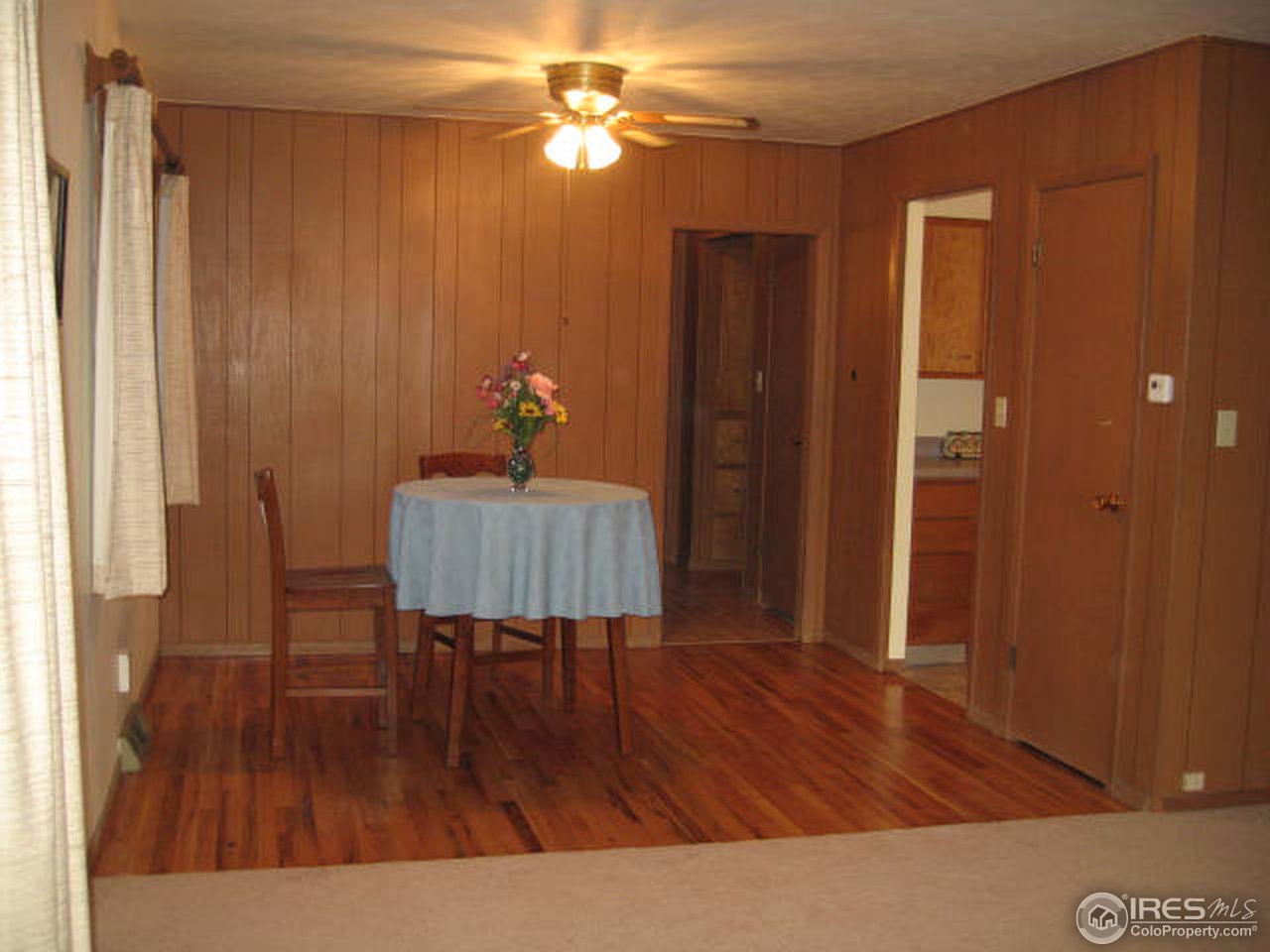 1208 Baker Street Fort Collins, CO 80524 - Photo 4 of 25 a living room with furniture and a wooden floor