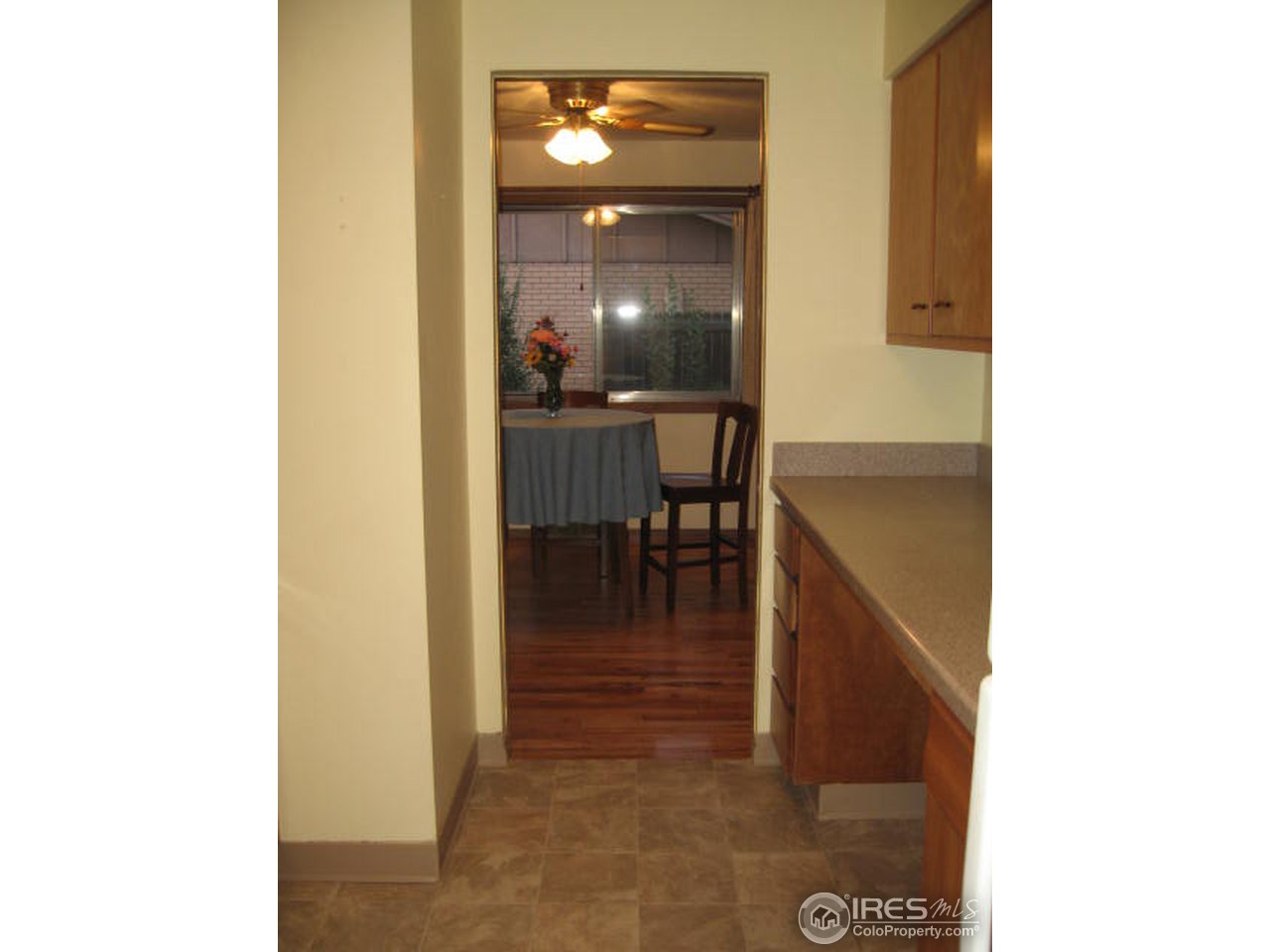 1208 Baker Street Fort Collins, CO 80524 - Photo 7 of 25 a view of a hallway with dining area and chandelier