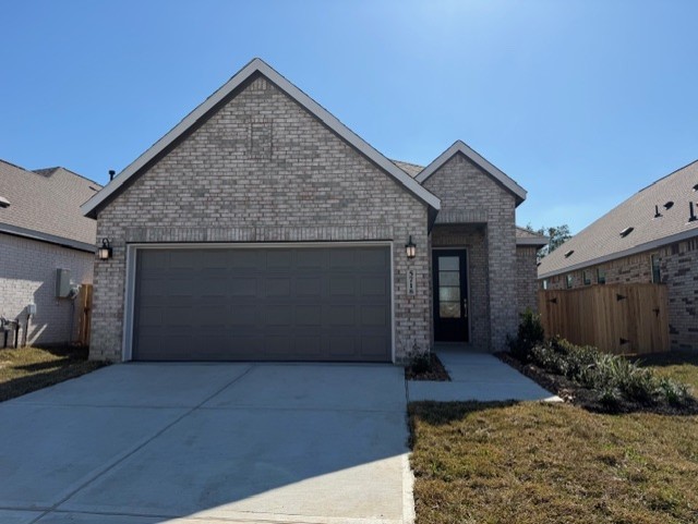 5718 Goosander Land Drive Baytown, TX 77521 - Photo 1 of 17 a view of a house with a garage