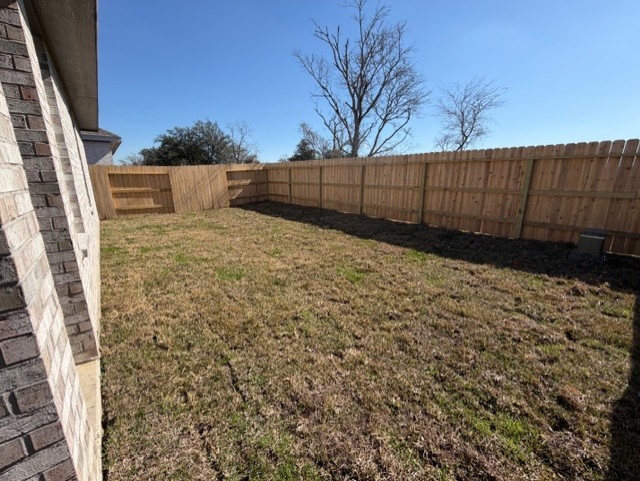5718 Goosander Land Drive Baytown, TX 77521 - Photo 2 of 17 a view of backyard with wooden fence
