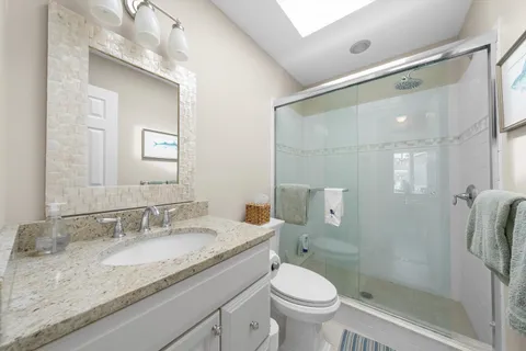 a balcony with outdoor seating and plants