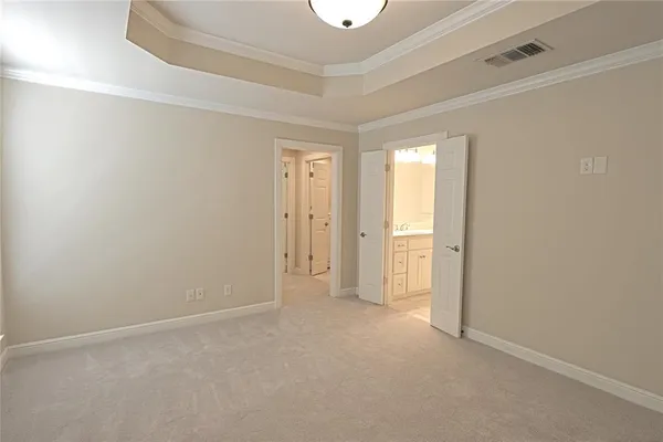 a view of an empty room and a window